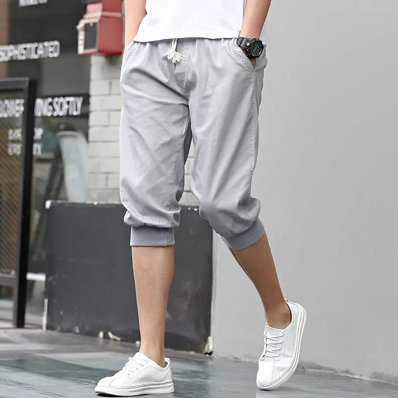 HEARUJOY  -  Summer New Sports Trend Versatile Casual Shorts Men's Solid Elastic Waist Drawstring Pockets Cotton Calf Length Cropped Pants